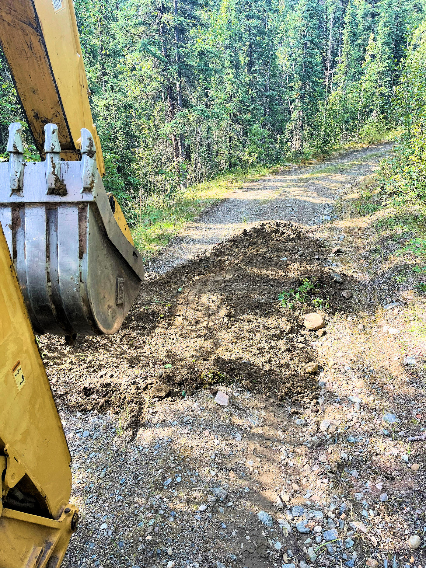 When building a gravel road, what does "Cutting water bars before gravel" refer to? Texoma Excavation & Construction